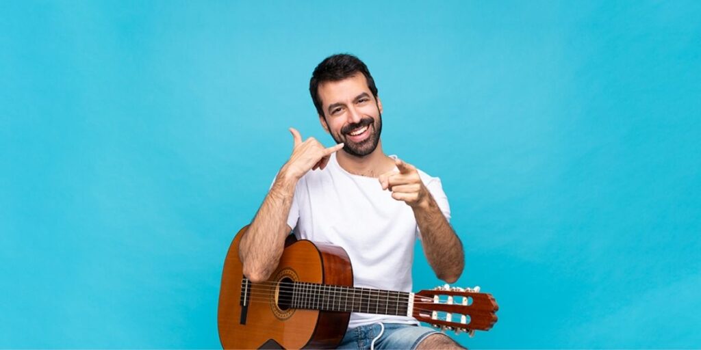a guitar player with a positive attitude