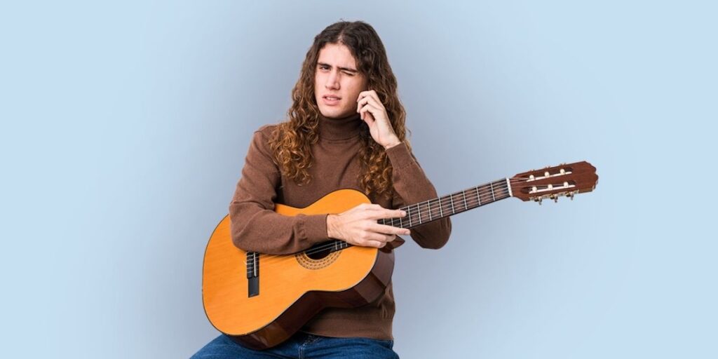 guitarist having trouble hearing